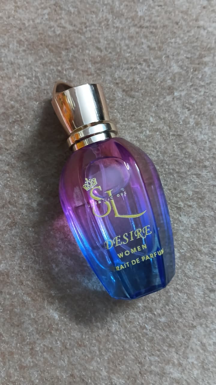 Perfume bottle labeled 'Desire' on a beig surface