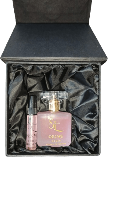 Two perfume bottles in a black satin-lined gift box