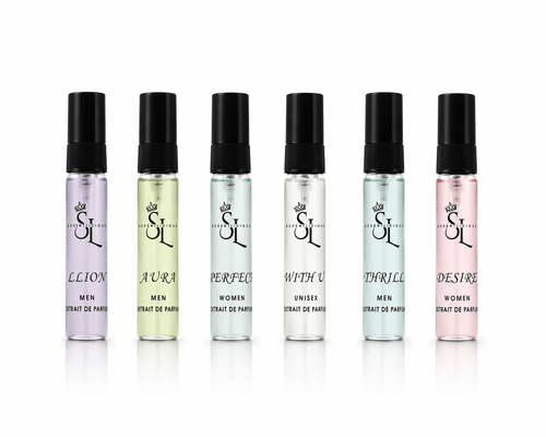 Set of six perfume bottles with black caps on a white background